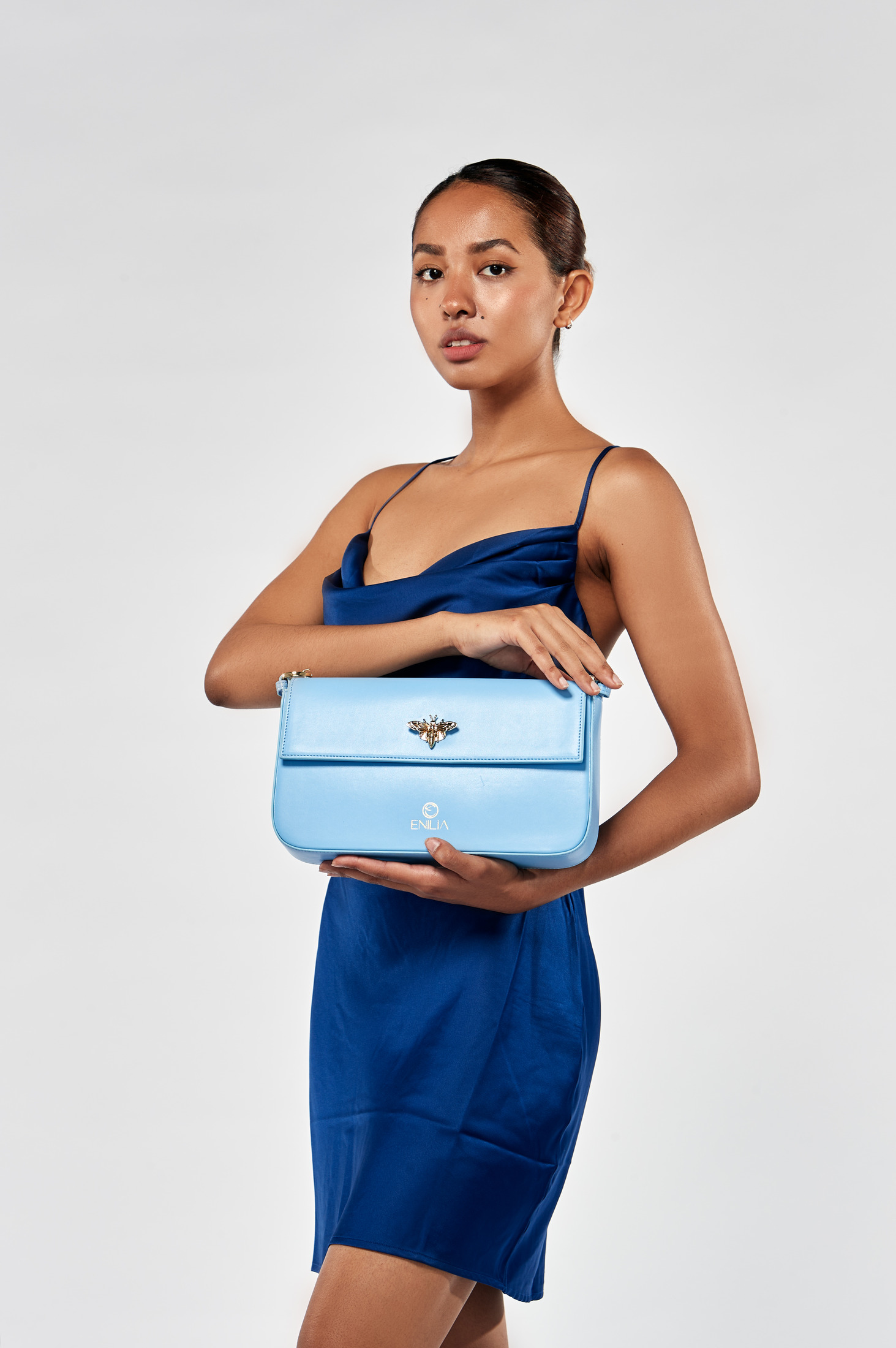 Model with the Enilia blue handbag, on-model product photography
